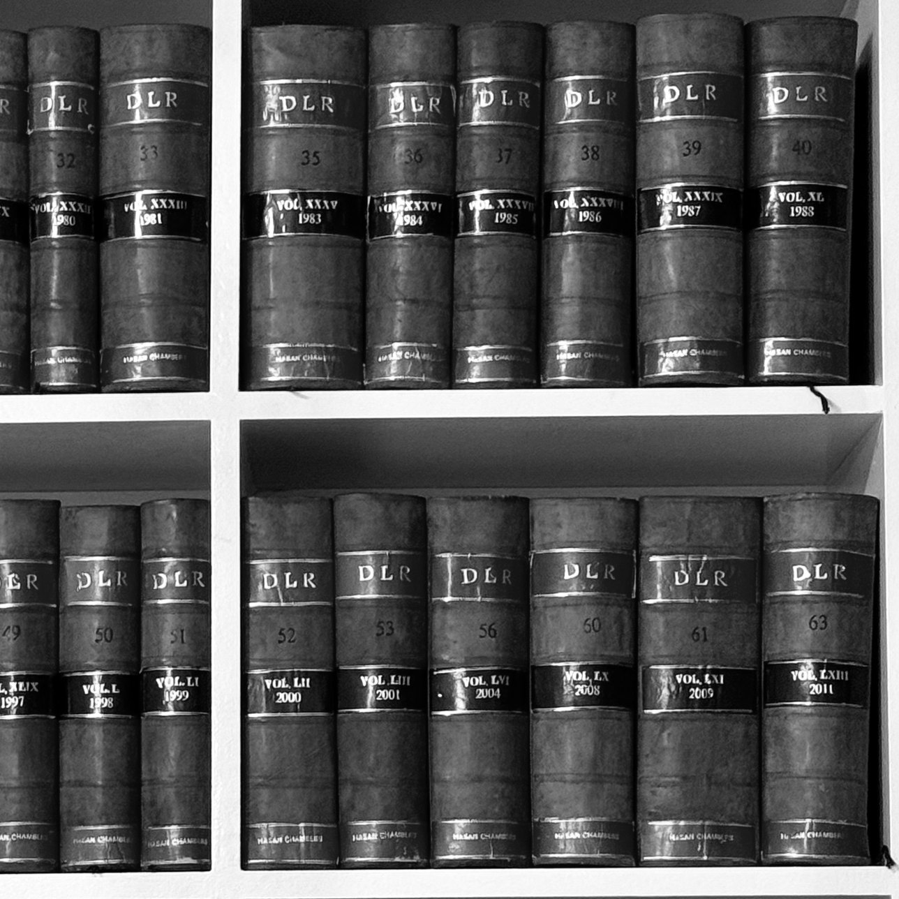 Bound volumes of the Dhaka Law Reports on the shelves at Hasan Chambers